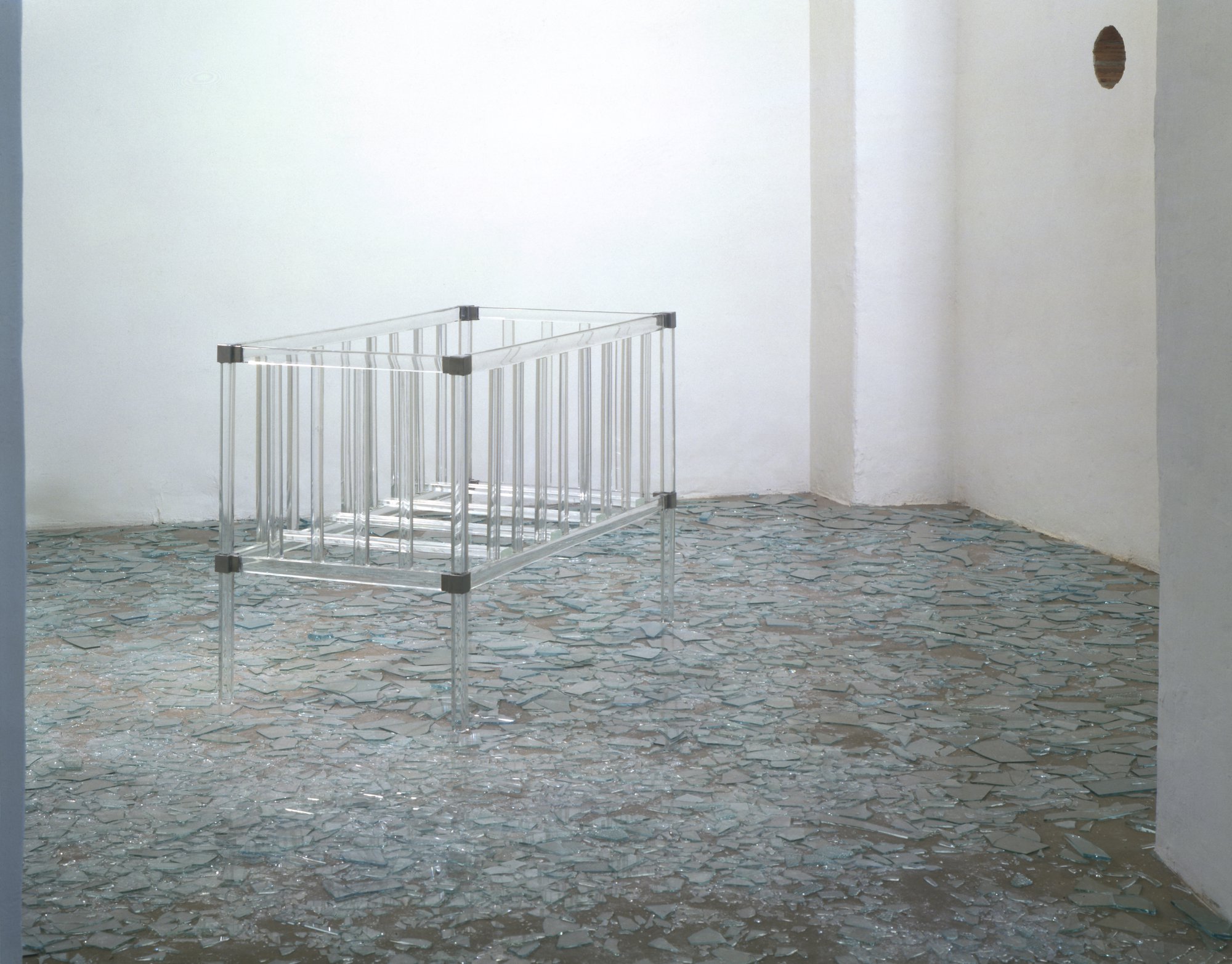 Liliana Moro, Torno Subito #2, bed in handcraft crystal, broken glass, hole in a wall, 88 x 132 x 68 cm, 2001. Installation view, Liliana Moro, Emi Fontana Gallery, Milan, 2001