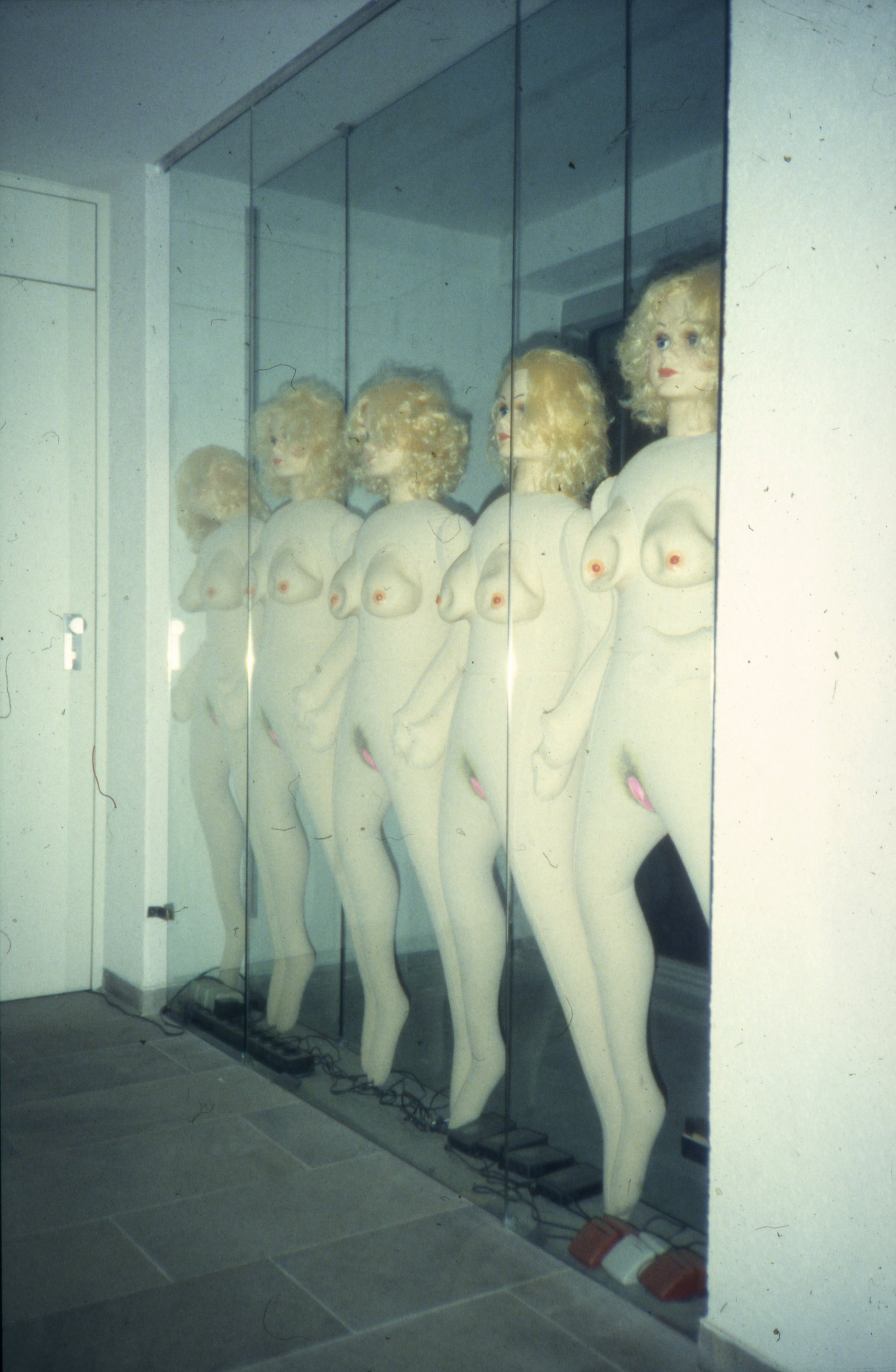 Liliana Moro, Fire, five inflatable dolls compressed between two glass plates, 1992. Installation view, Documenta IX, Kassel, 1992
