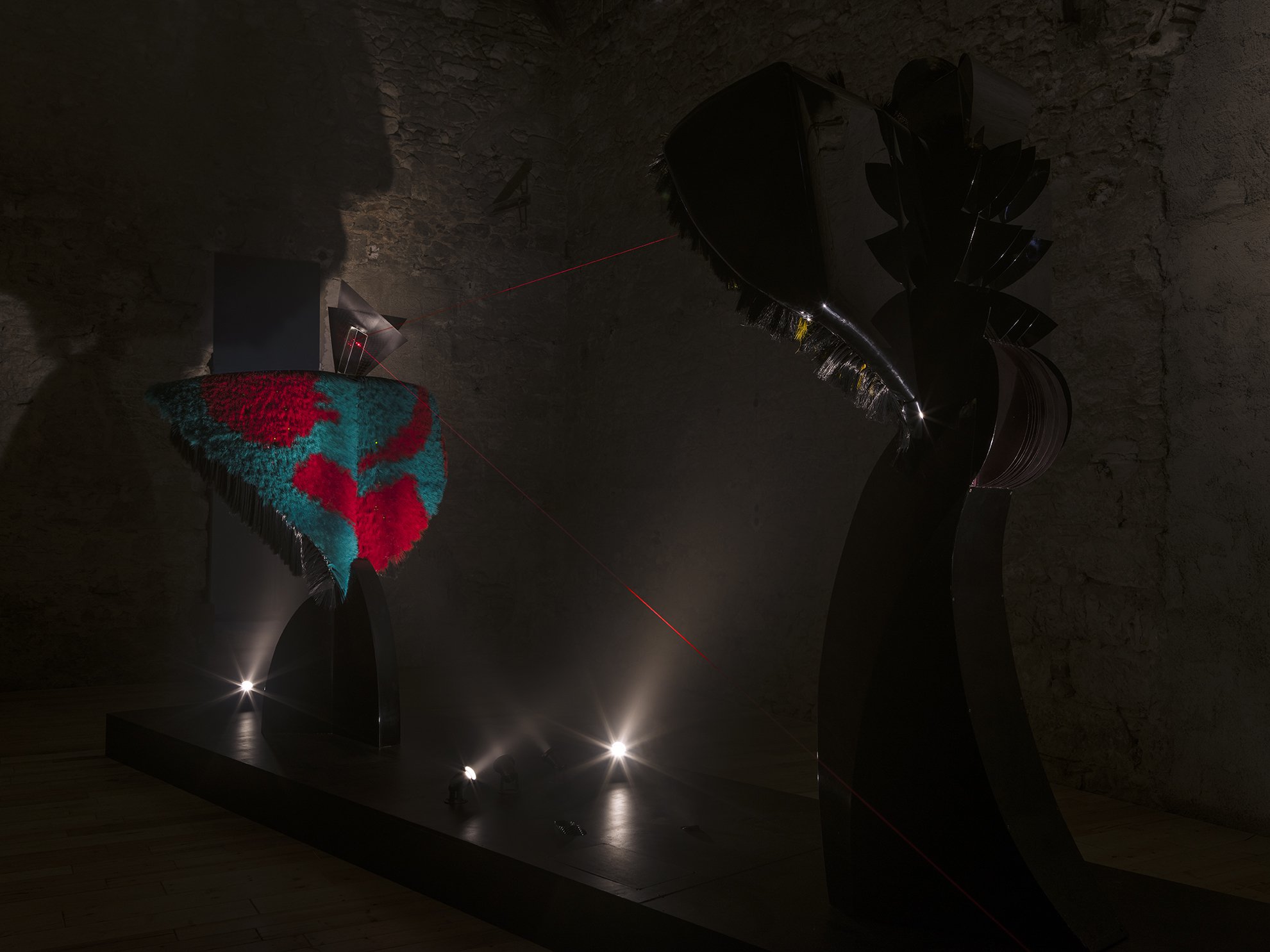Liliane Lijn, Conjunction of Opposites: Woman of War and Lady of the Wild Things, installation of two mixed media performing sculptures, 400 x 800 x 400 cm, 1986. Installation view, Cosmic Dramas, Rodeo, Piraeus, 2018
