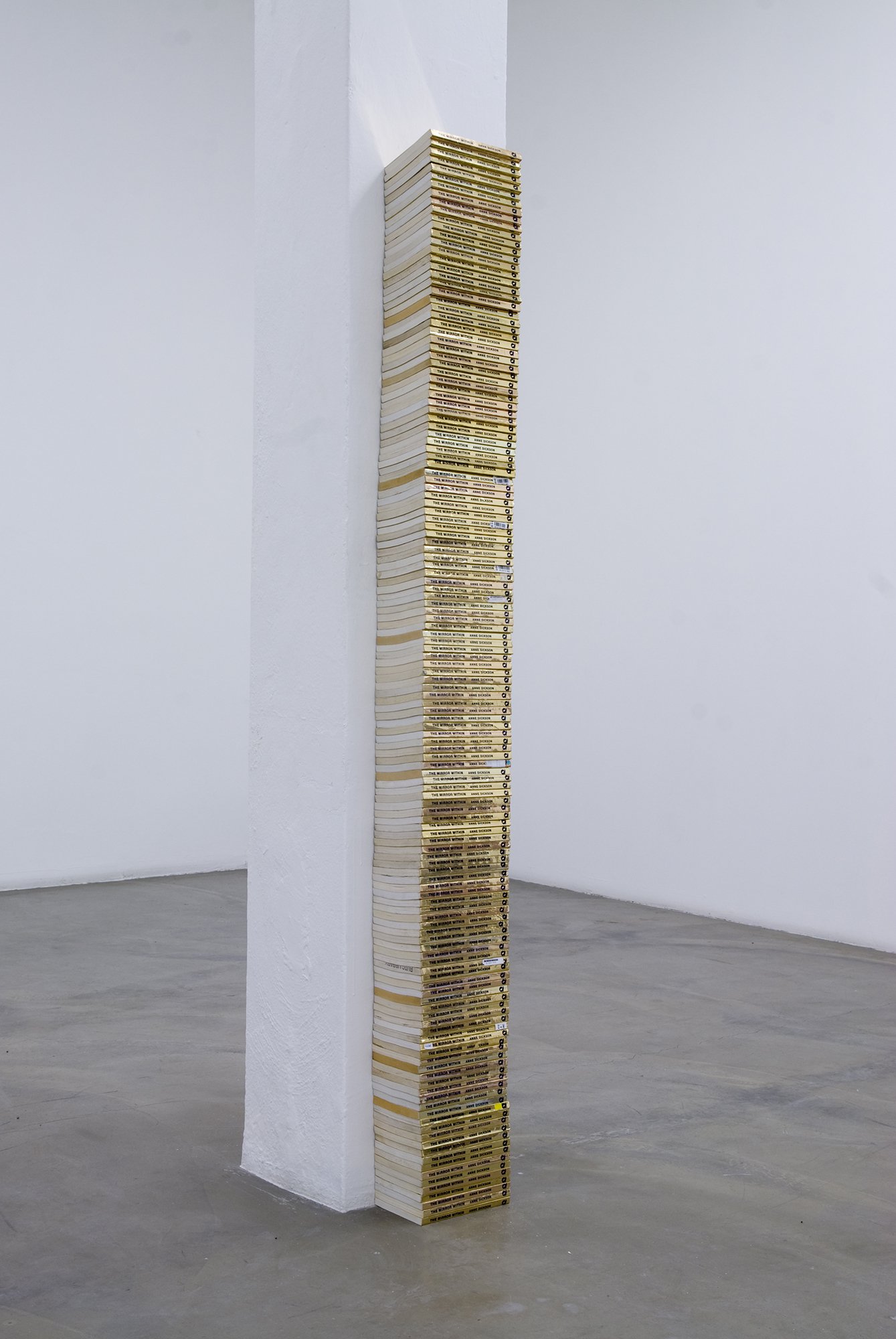 James Richards, Untitled (The Mirror Within), stacked second hand books, 180 x 19,5 × 13 cm, 2010-2011. Installation view, James Richards, Rodeo, Istanbul, 2011