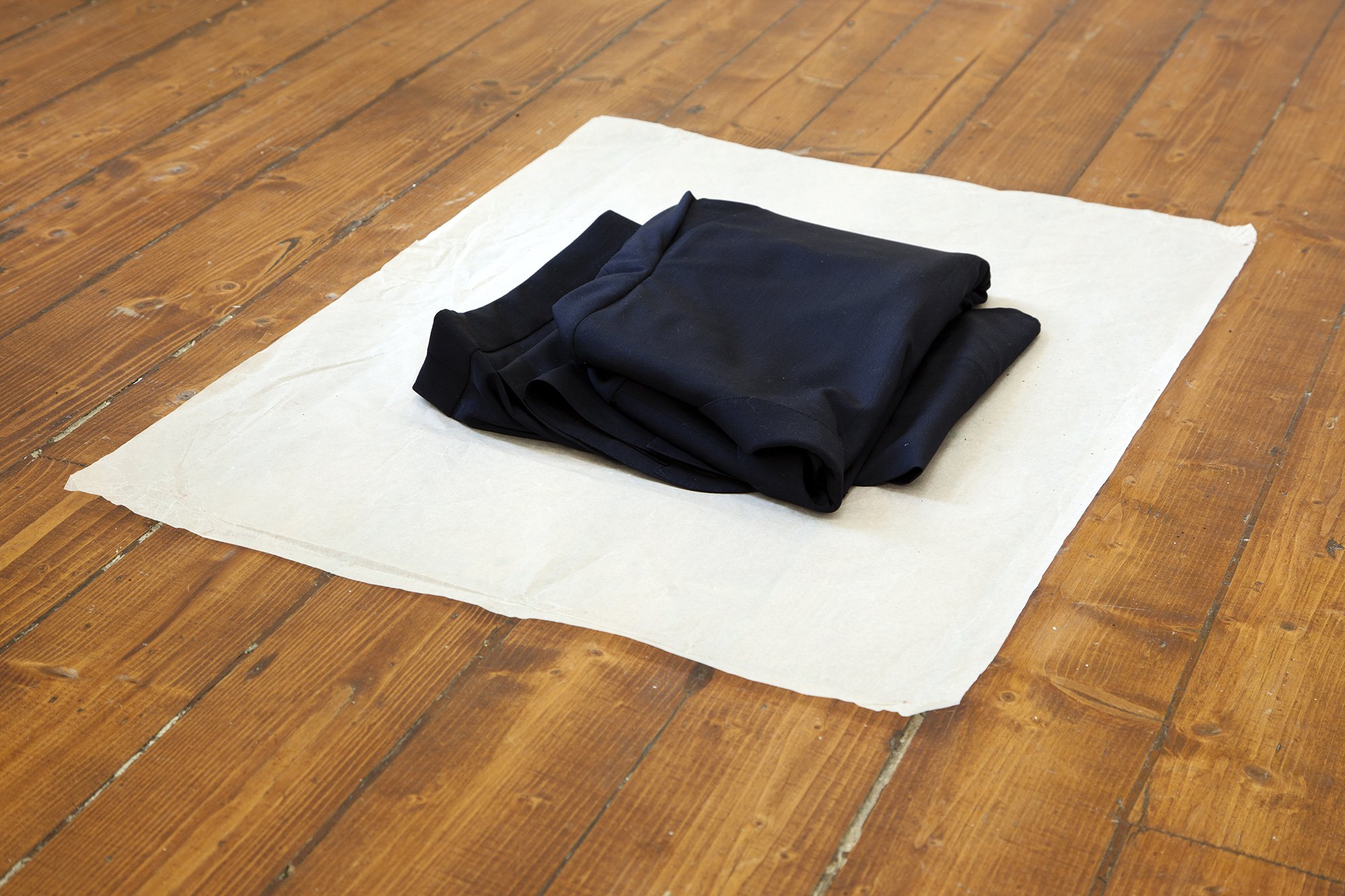 Christodoulos Panayiotou, Suit, hand made suit, Amadeus Tropical, 8 ounce (240 gram) navy, plain wave fabric in 100% wool, paper, dimensions variable, 2012. Installation view, Tenuto, Rodeo, Istanbul, 2012 – 2013