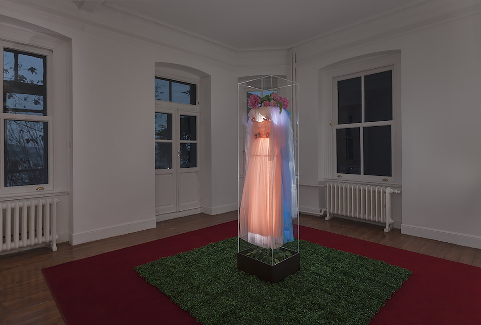 Gülsün Karamustafa, The Monument of Kitsch 2, found tulle dresses, plastic flowers and plants, iron structure, fluorescent lights, wooden base, plexiglass, dimensions variable, 1988 – 2013. Installation view, Talisman, Rodeo, Istanbul, 2013