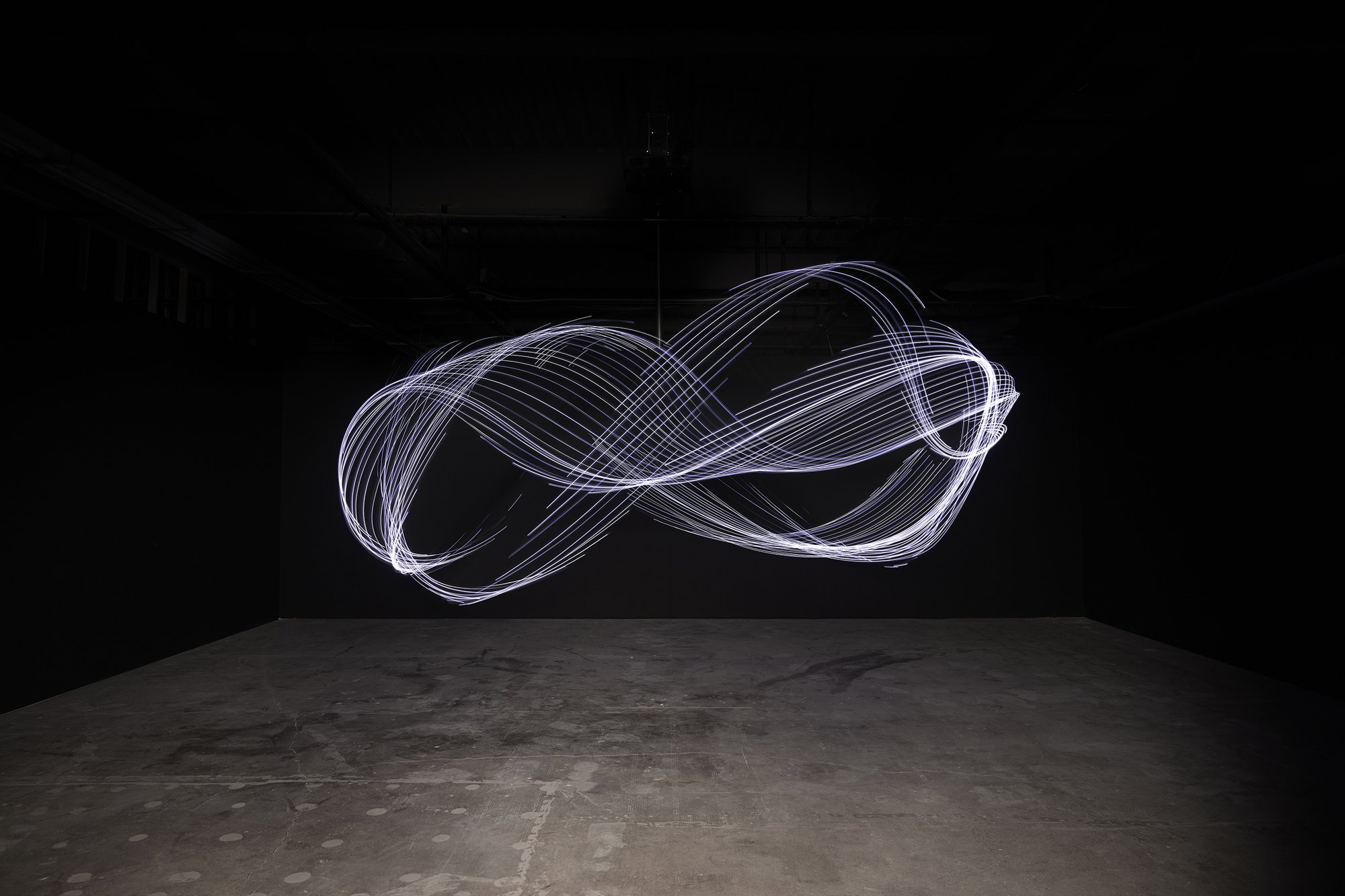 Liliane Lijn, Gravity’s Dance, black weighted cloth, LEDS, Forex central stiffener, 3 phase motor, inverter, control system, ∅ 600 cm, 2019