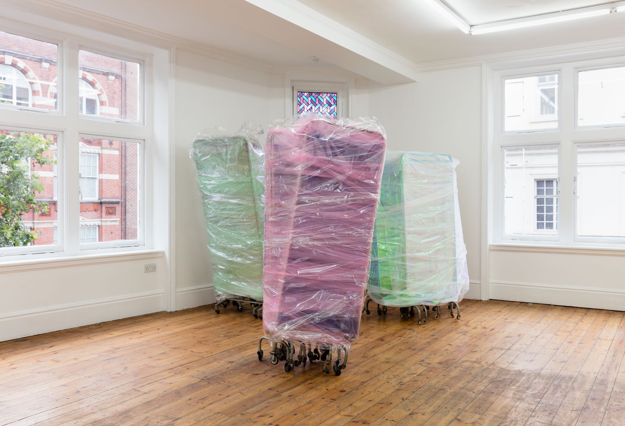Ian Law, There was a body, I was there, was a body, medical privacy screens with soft toy fur fabric, curtain netting and organza, gift wrapped, 172 x 86 x 47 cm, 2016. Installation view, The Cypress Broke, Rodeo, London, 2016